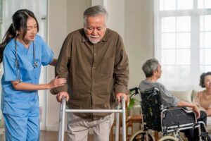Family member reviews a care plan with an assisted living resident at a quiet table.